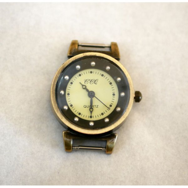 Sort og bronze fjeder urskive